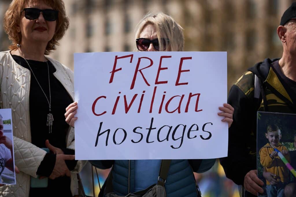 Ukrainian,Activist,Holds,A,Banner,"free,Civilian,Hostages",On,A