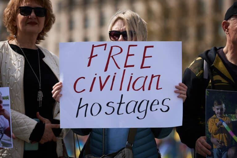 Ukrainian,Activist,Holds,A,Banner,"free,Civilian,Hostages",On,A